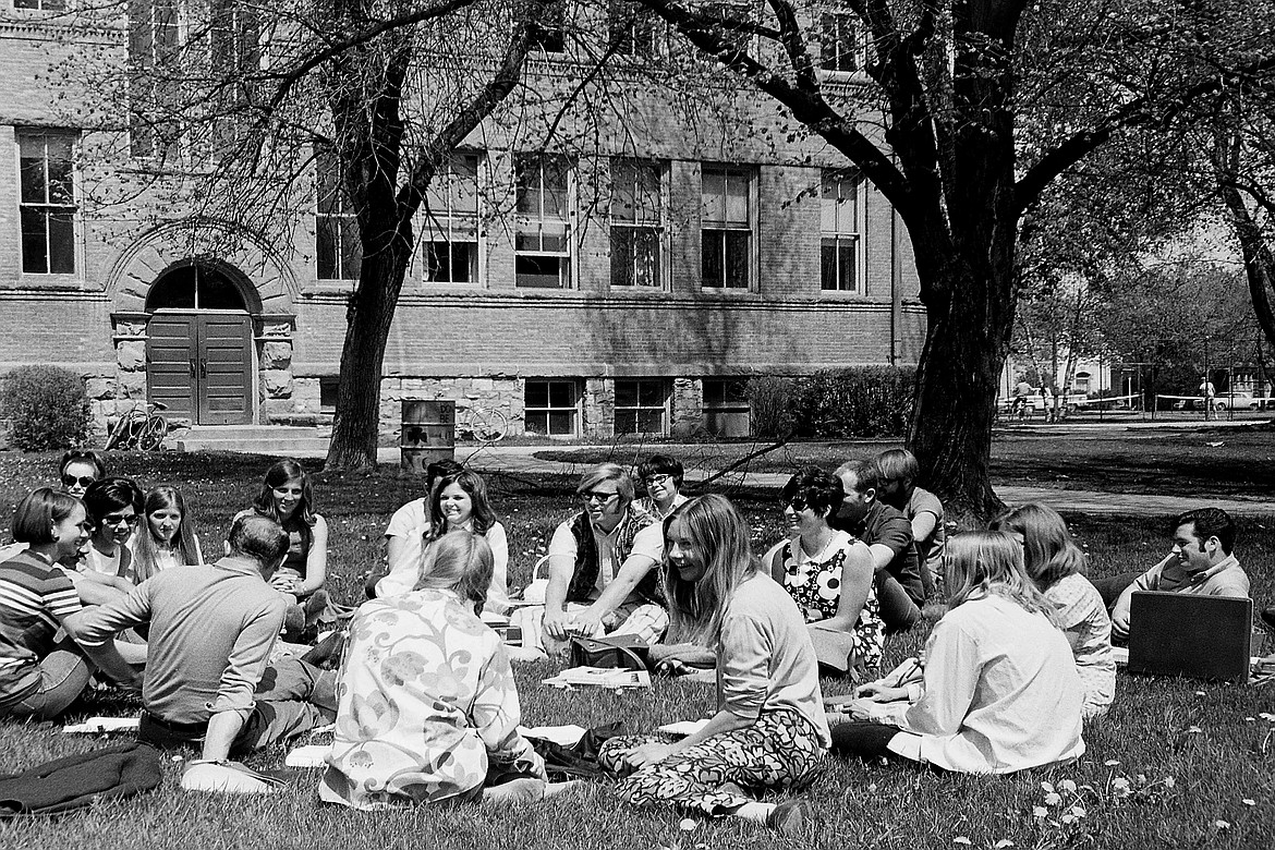 Flathead Valley Community College students gather on the lawn at Central School in Kalispell in this undated photo. (FVCC photo)