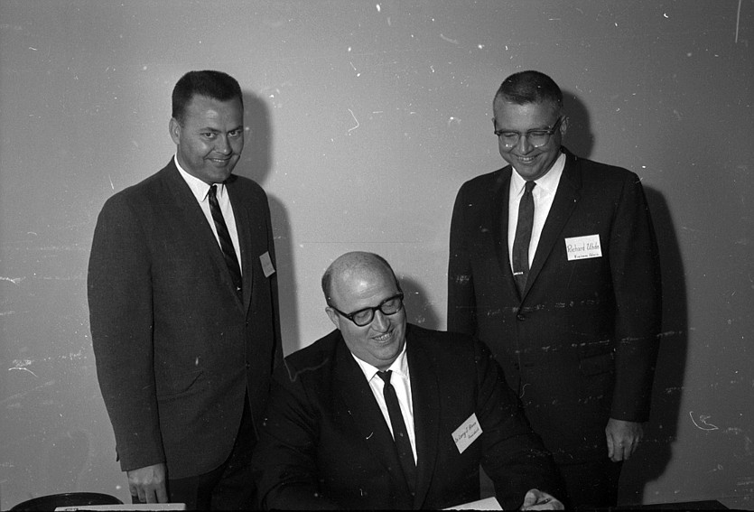 The faculty of Flathead Valley Community College assembled for a week-long workshop starting on Sept. 11, 1967, at the Community College Center. Shown above are, from left, Orlyn Knutson, secretarial course instructor; Dr. Larry Blake, the college&#146;s first president; and Richard Uhde, right, business administration instructor.