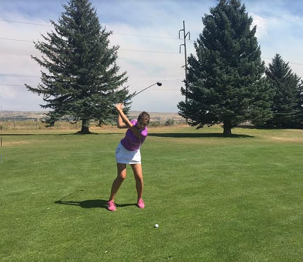 Kat Rauenhorst shows off her driving power at the Sand Creek golf course in Idaho Falls.