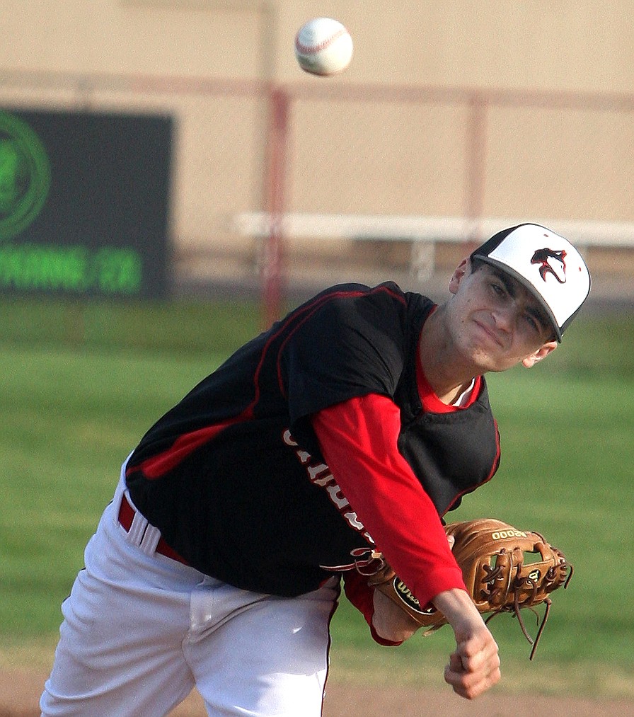 Rodney Harwood/The Sun Tribune - Jon Garza delivers to the plate during the second game of Friday's douleheader against Grandview. Garza was credited with the win for the Huskies.