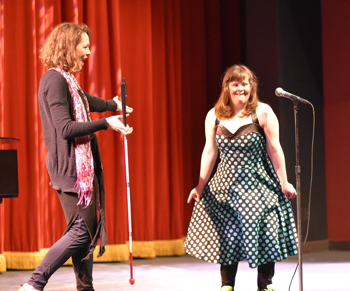 Whitefish High School student council held its annual Talent Show Thursday showcasing the talents of several students who sang, danced and performed comedy acts. Abi Kurtz takes a bow after singing while being congratulated by Emily Hackethorne, who accompanied the song on piano.  (Heidi Desch/Whitefish Pilot)