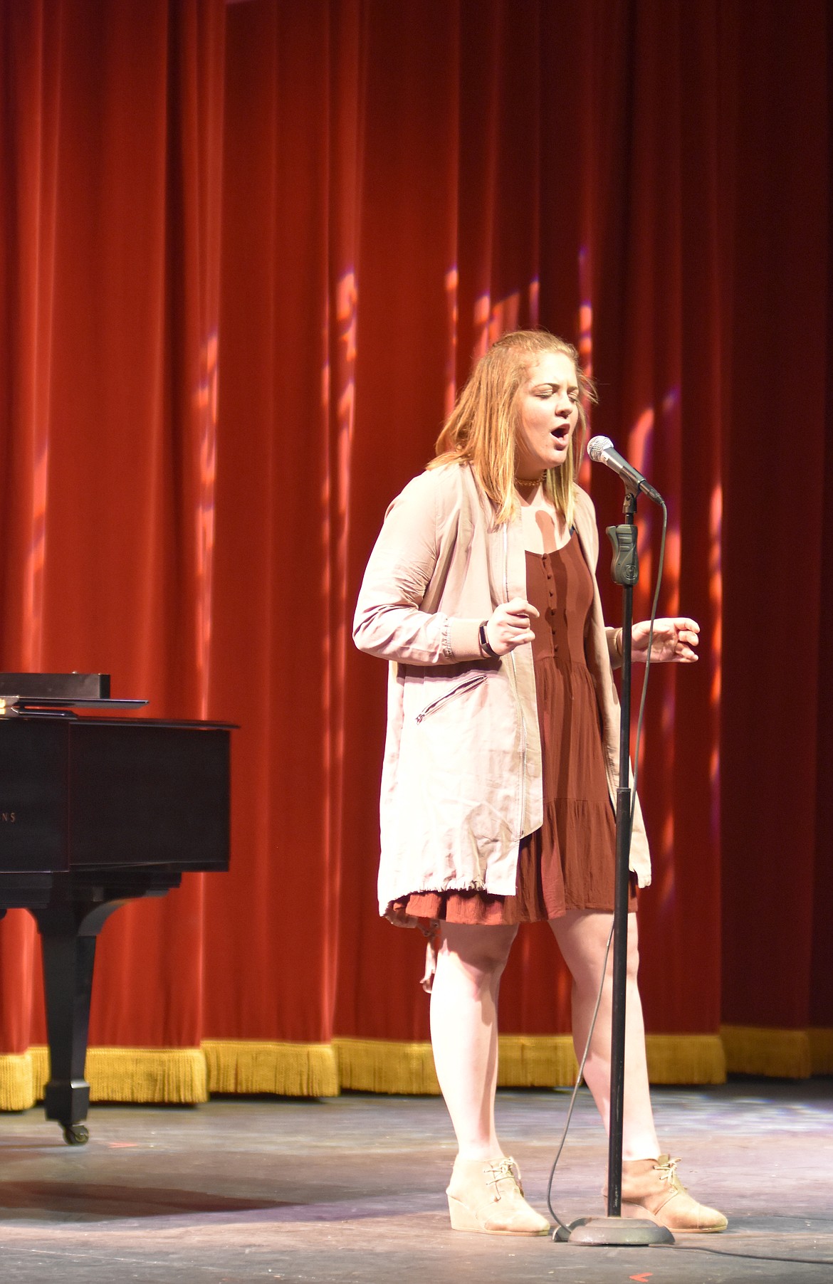 Whitefish High School student council held its annual Talent Show Thursday showcasing the talents of several students who sang, danced and performed comedy acts. Delaney Lewis sings &#147;I Want to Hold Your Hand&#148; by the Beatles. (Heidi Desch/Whitefish Pilot)