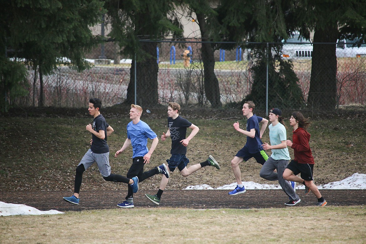 &#151;Photo by MANDI BATEMAN
As the last of the snow finally melts away, the track team takes their practice back outside.