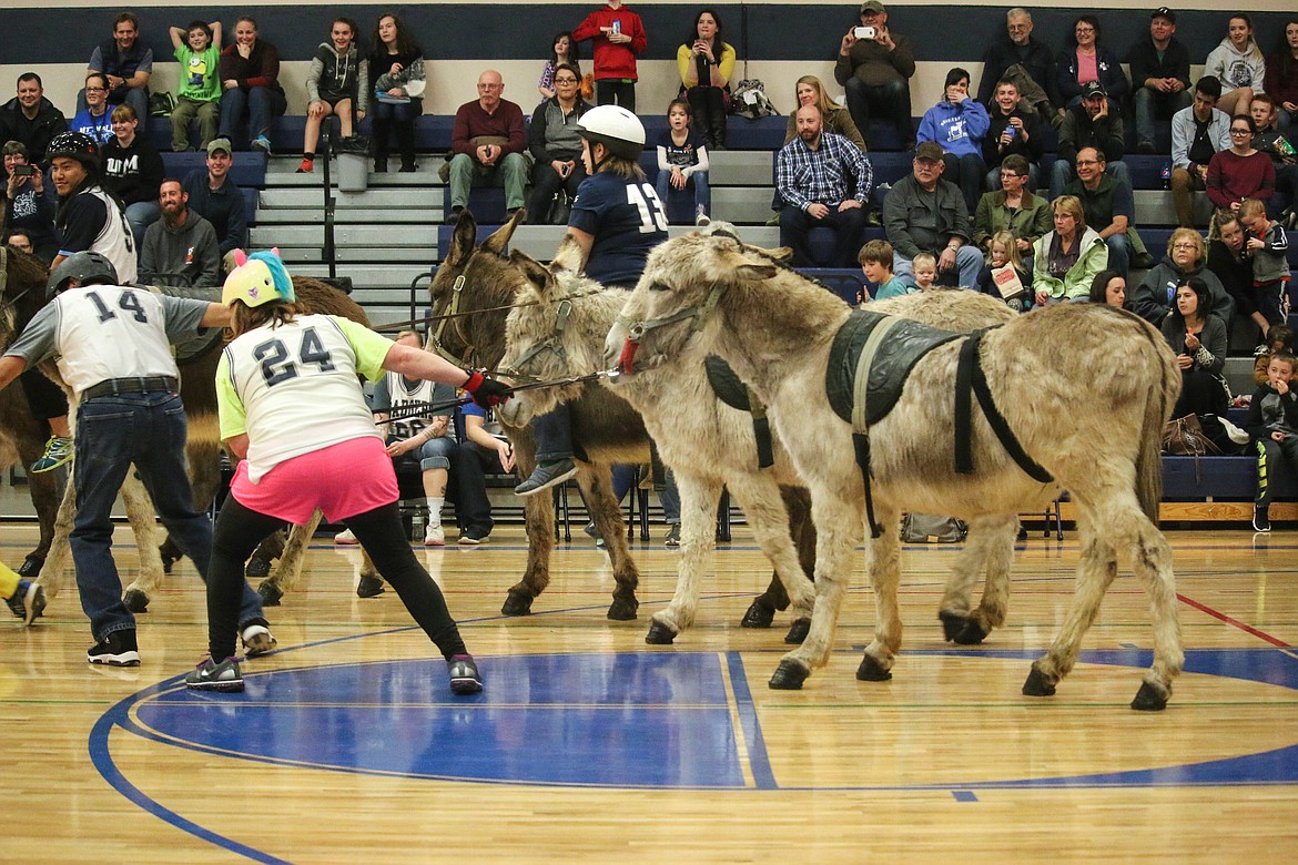 &#151;Photo by MANDI BATEMAN
&#147;It&#146;s hard to hustle a donkey.&#148; First game of the Donkey Basketball, High School versus Middle School.