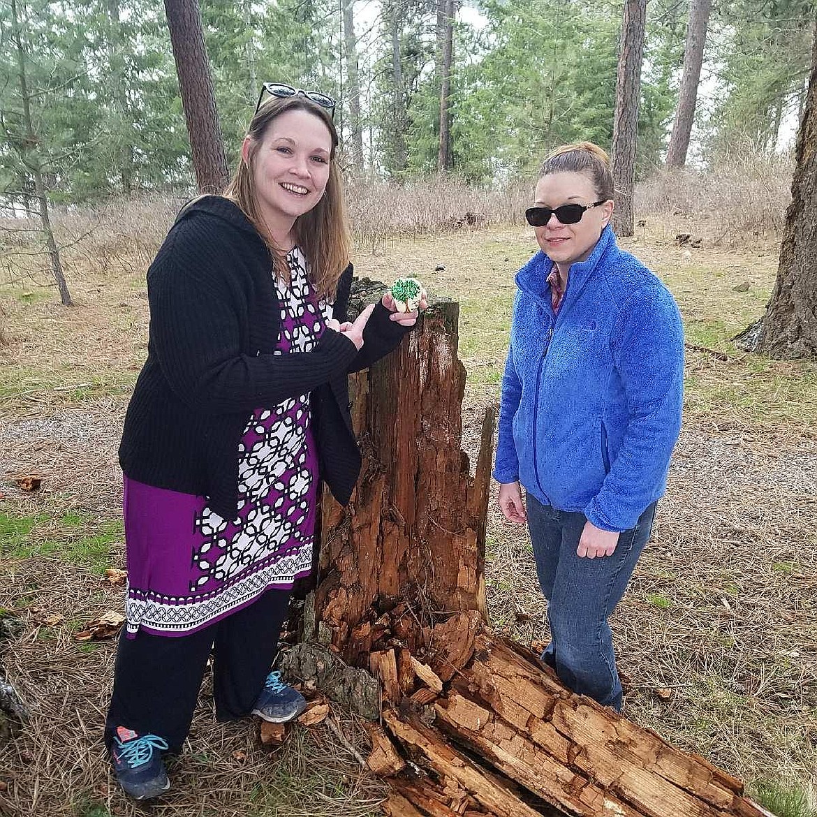 Courtesy photo
Press staff writer Devin Heilman, left, with best friend and Press receptionist Holly Fredericks, found a beautifully painted rock with the message &quot;Spring is here&quot; at Higgens Point on Sunday. Those who find these special rocks are enouraged to post photos of their finds to the Coeur d'Alene Rocks Facebook page.