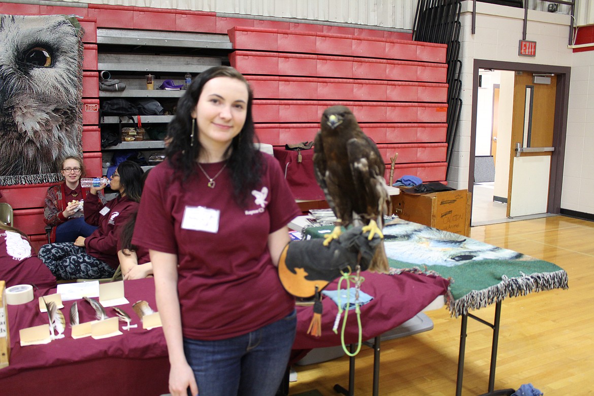 Chanet Stevenson/The Sun Tribune - Washington State University Raptor Club member Kalayha holds a Red-tailed Hawk Dark Morph named Brenda. Red-tailed Hawks are not common to the Othello area.