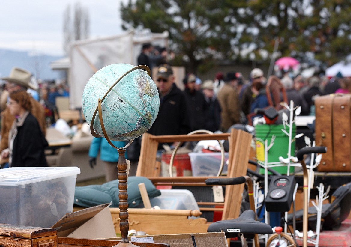A globe sits on a dresser and was one of thousands of items auctioned off on Saturday.