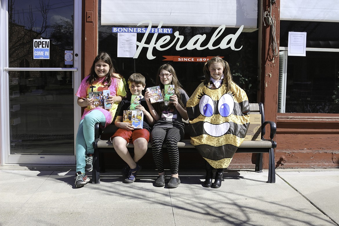 &#151;Photo by MANDI BATEMAN
These cuties stopped by the Herald to sell Girl Scout cookies on Sunday. From left to right, Nora Young, Logan Brinkman (Brother of Liliana and loyal cookie customer, but not a girl scout!) Liliana Brinkman, and Makena Sandel.
FOR SALE: Girl Scout Cookies! The Girl Scouts will be having a booth sale at Safeway on EASTER weekend.