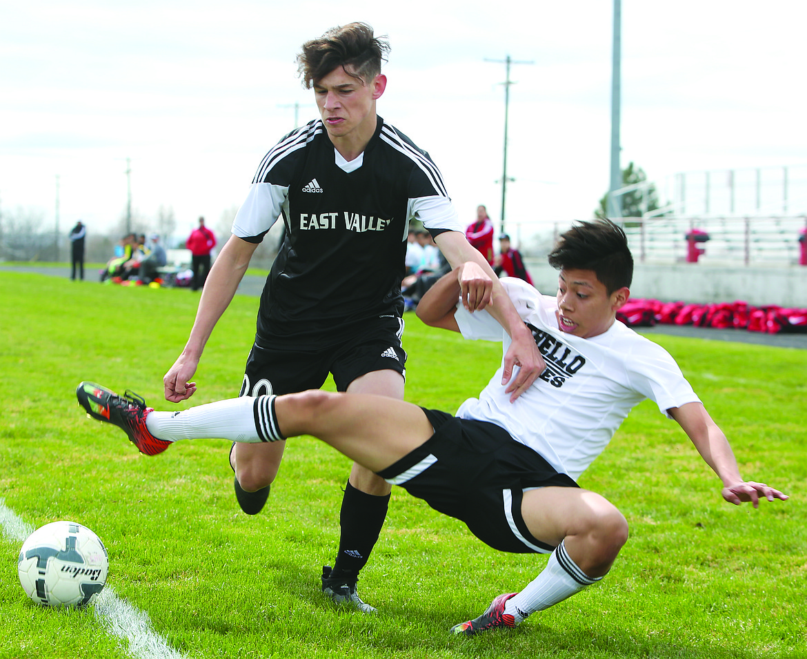 Connor Vanderweyst/Columbia Basin Herald
Othello forward Frankie Ramos is tackled by an East Valley defender.