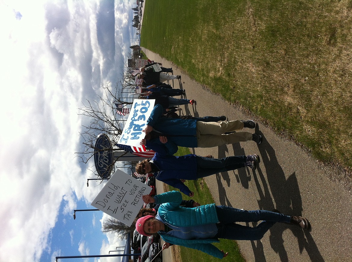 STEVE CAMERON/Press
Protesters came from all over North Idaho on Saturday for an anti-Trump tax day march on U.S. 95 near Dalton Avenue, part of a nationwide movement and marches objecting to Trump&#146;s policies and demanding that he make his tax returns public.