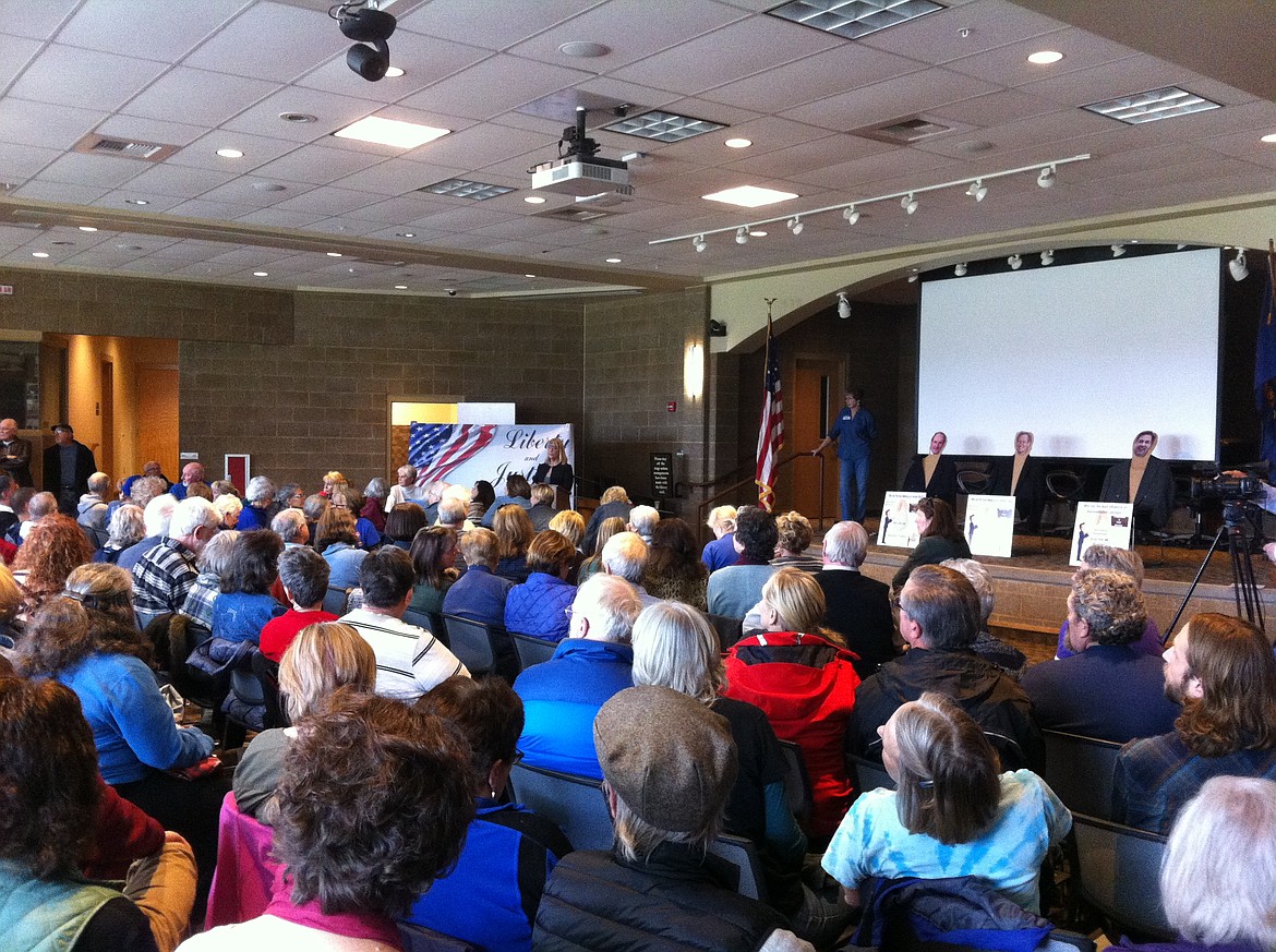 STEVE CAMERON/Press
An estimated 300 packed the Coeur d'Alene Library's Community Room on Saturday for a tax day town hall, asking questions of, from left, U.S. Sens. Jim Risch and Mike Crapo, and U.S. Rep. Raul Labrador. The politicians were invited and did not come, so they were represented by very lifelike cardboard cut-outs &#151; along with a fact box indicating exactly how much money they had accepted from special interest groups.