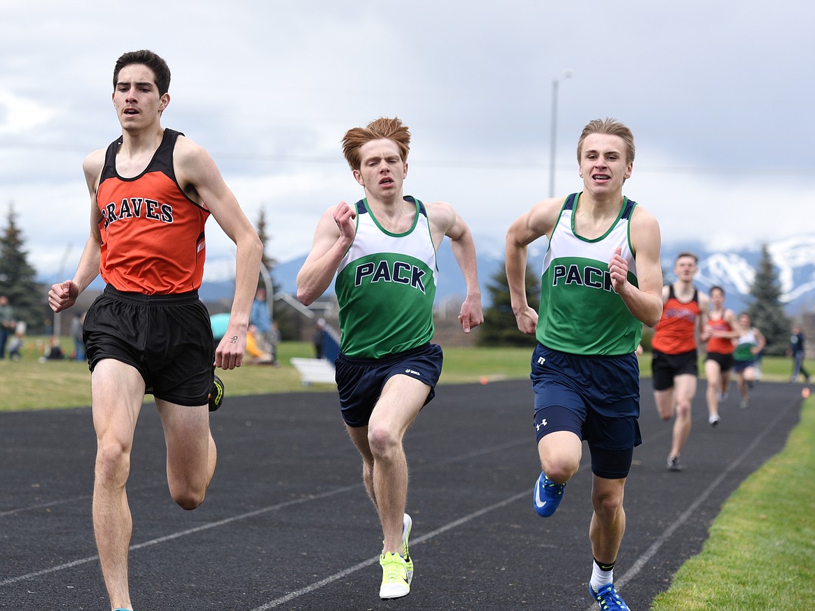 Flathead&#146;s Kyle Calles outlegs Glacier&#146;s Tucker Salmonsen and Brock Adkins down the stretch of the boys 800-meter run at the crosstown track dual on Tuesday at Glacier High School. (Aaric Bryan/Daily Inter Lake)