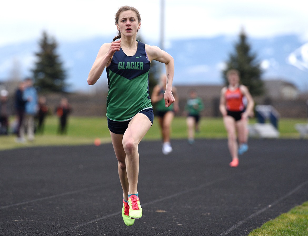Glacier junior Annie Hill powers down the homestretch of the 400-meter at the Crosstown Track Meet at Glacier on Tuesday. (Aaric Bryan/Daily Inter Lake)