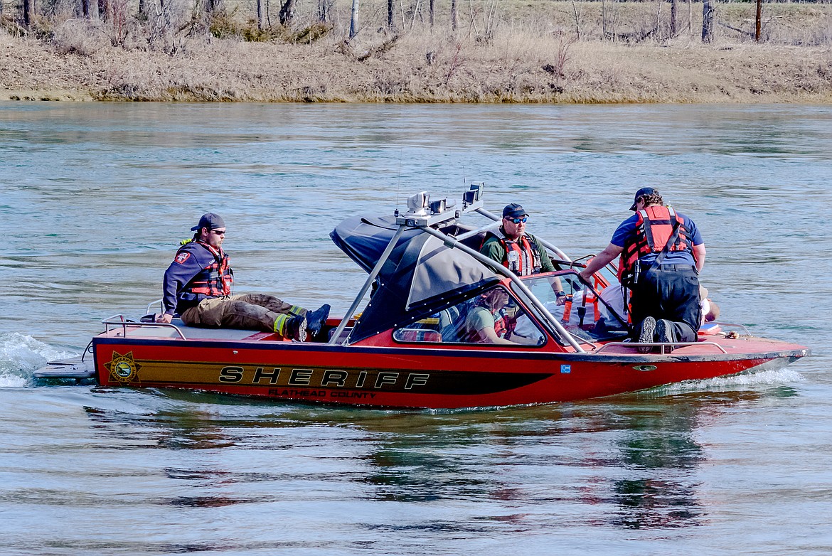 Flathead County Sheriff&#146;s Office deputies work to rescue a suspect on the Flathead River. (Photo courtesy of Jim Rahn)