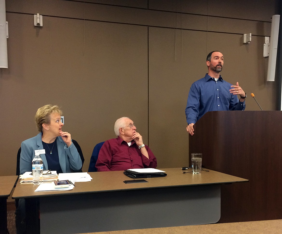 Idaho Sen. Shawn Keough, left, and former legislator George Eskridge, center, listen as Rep. Sage Dixon talks at a recent Bonner County Area Transportation Team meeting.

(Photo by KEITH KINNAIRD)