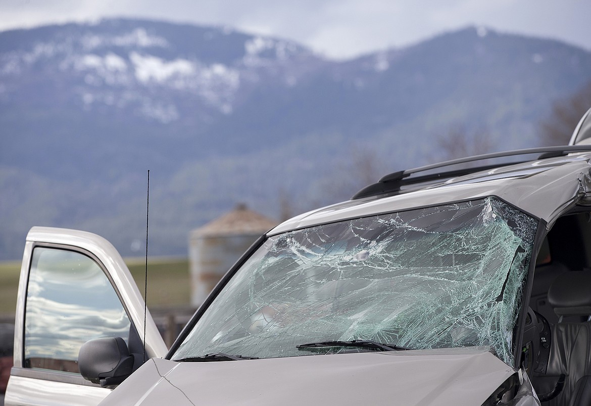 LISA JAMES/Press
The front window of a Chevy Trailblazer was smashed and the side crunched in after the vehicle collided with a train on Heutter Road in Rathdrum Thursday afternoon. One of the two teens in the vehicle had to be extricated, and both were transported to Kootenai Health.