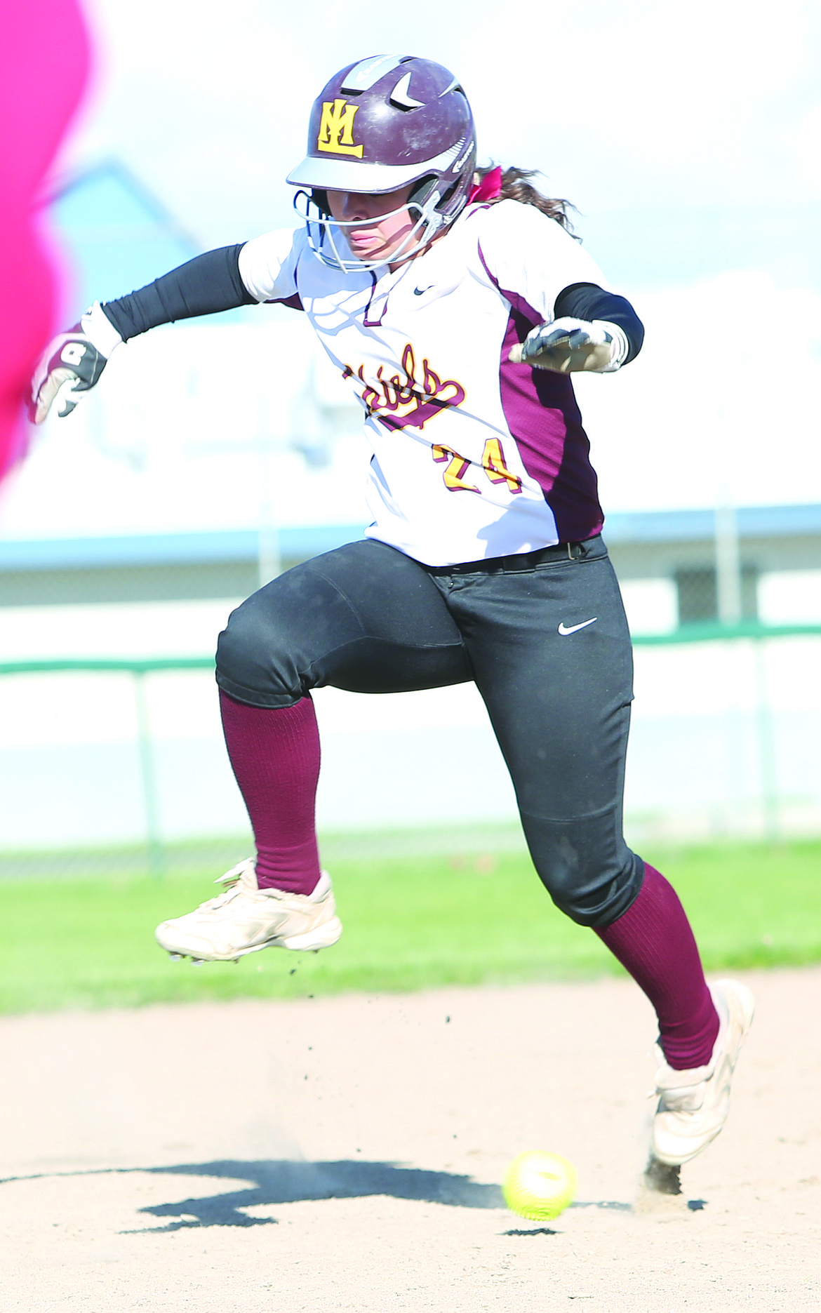 Connor Vanderweyst/Columbia Basin Herald
Brooklyn Bailey jumps over the ball on her way to third base.