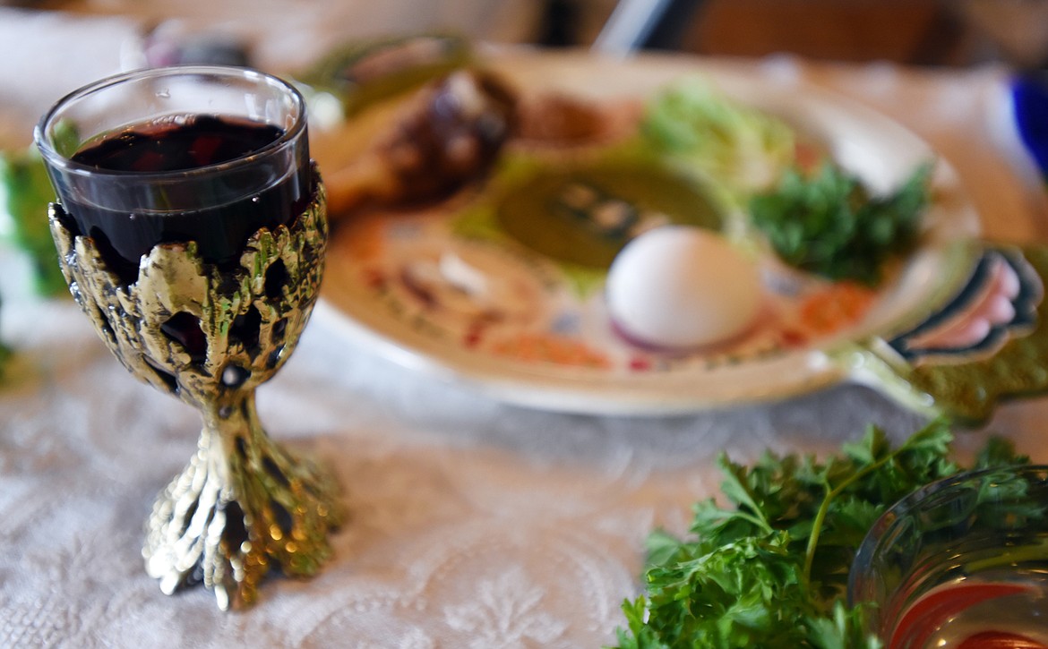 The Cup of Elijah is a glass of wine that sits on the table near the seder plate (in background). The cup is one of the traditions of Passover. It represents the hope that this may be the time when the prophet will come and announce the messiah is coming, and so people put a cup of wine to invite him.&#160;(Brenda Ahearn/Daily Inter Lake)