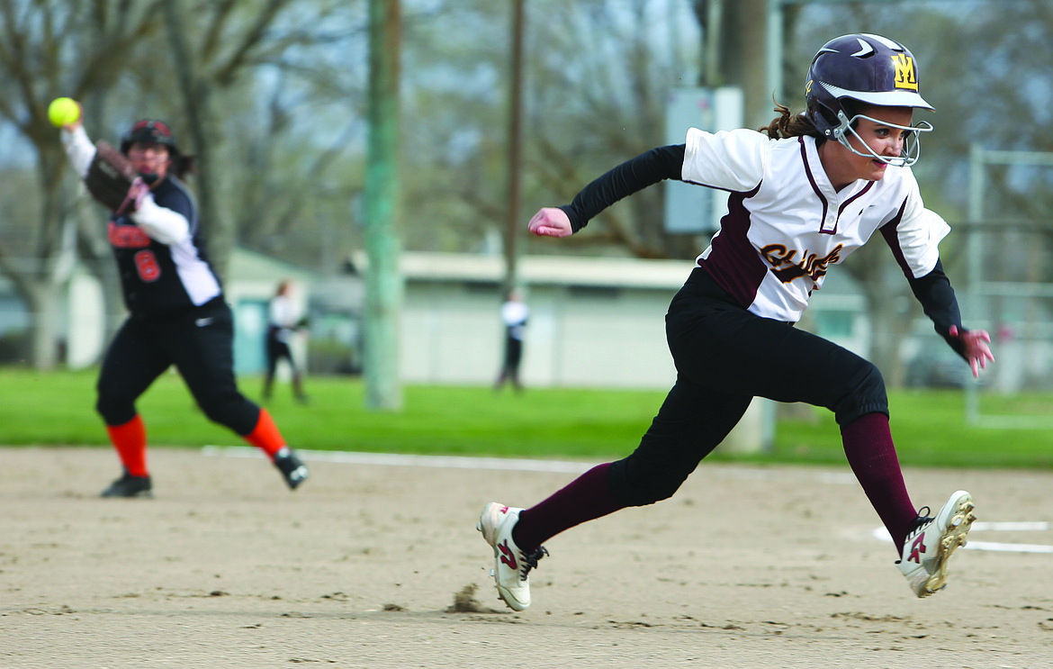 Connor Vanderweyst/Columbia Basin Herald
Moses Lake courtesy runner Cheyenne Walker begins her slide into third base against Davis.