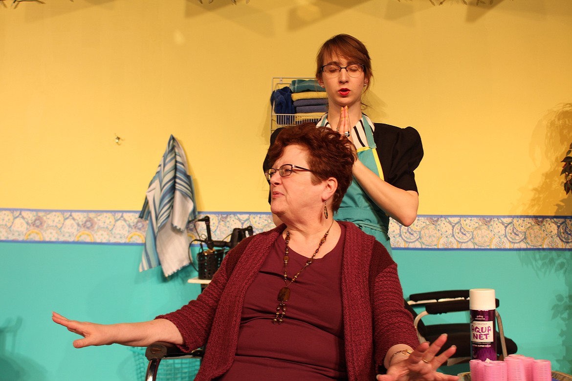 Cheryl Schweizer/Columbia Basin Herald
Clairee (Cheri Barbre, front) discusses her family&#146;s foibles while Annelle (Emma Russell, background) says a prayer in the Masquers production of &#145;Steel Magnolias,&#146; opening April 21.