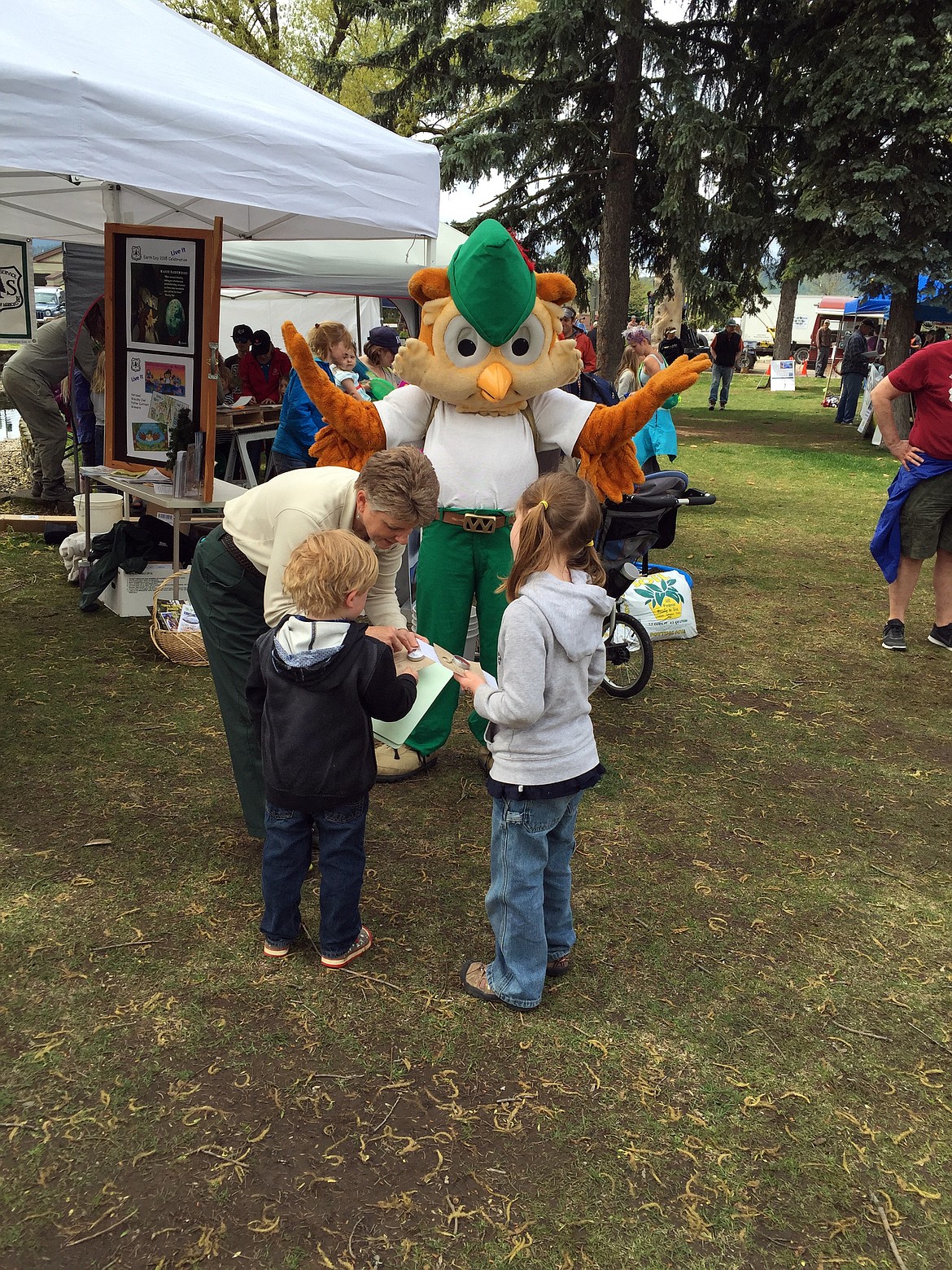 WOODSY OWL, the mascot for the United States Forest Service, and his helper share some knowledge at the 2016 Flathead Earth Day Celebration. (Photo courtesy of Citizens for a Better Flathead)