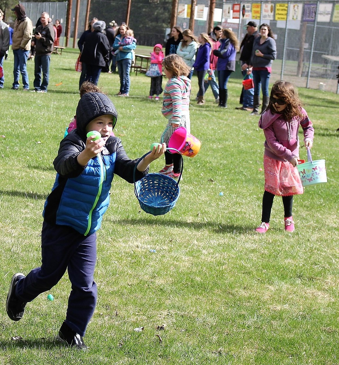 5 and 6-year-olds scooped up eggs and candy during the annual Easter Egg Hunt in St. Regis. (Kathleen Woodford/Mineral Independent).