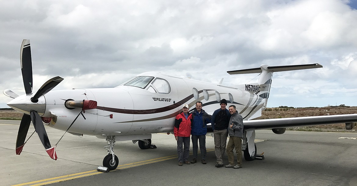 Jerry Seckler, Jack Long, Josh Marvil and Giuseppe Caltabiano pose next to Long&#146;s Pilatus PC-12 in Puntas Arenas, Chile.