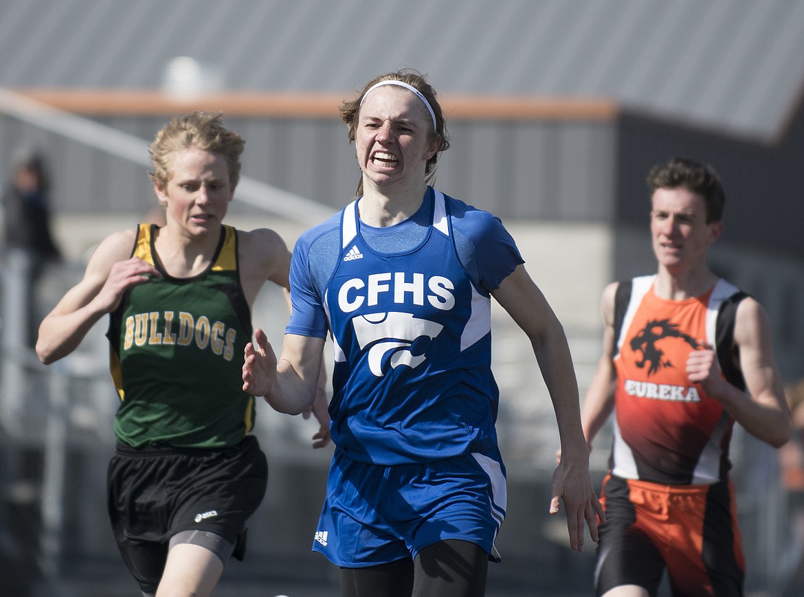 Wildcat Drew Morgan, center, guts out the 800 meters at the Flathead Invitational last week.