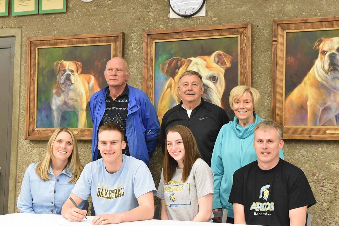 Whitefish senior Derek Kastella signs his letter of intent to play basketball at the University of Great Falls.