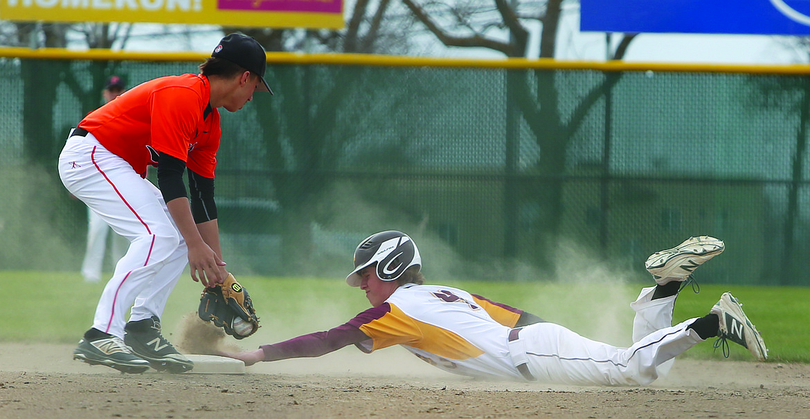 Connor Vanderweyst/Columbia Basin Herald
Moses Lake's Kameron Huberdeau (right) slides into second base safely.
