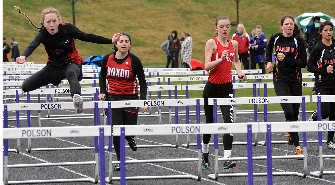 HOT SPRINGS track athlete Elena McAllister competes in the 100-meter hurdles Thursday afternoon at the Dave Tripp Memorial track meet at Polson High School. (Jason Blasco photos/Lake County Leader)