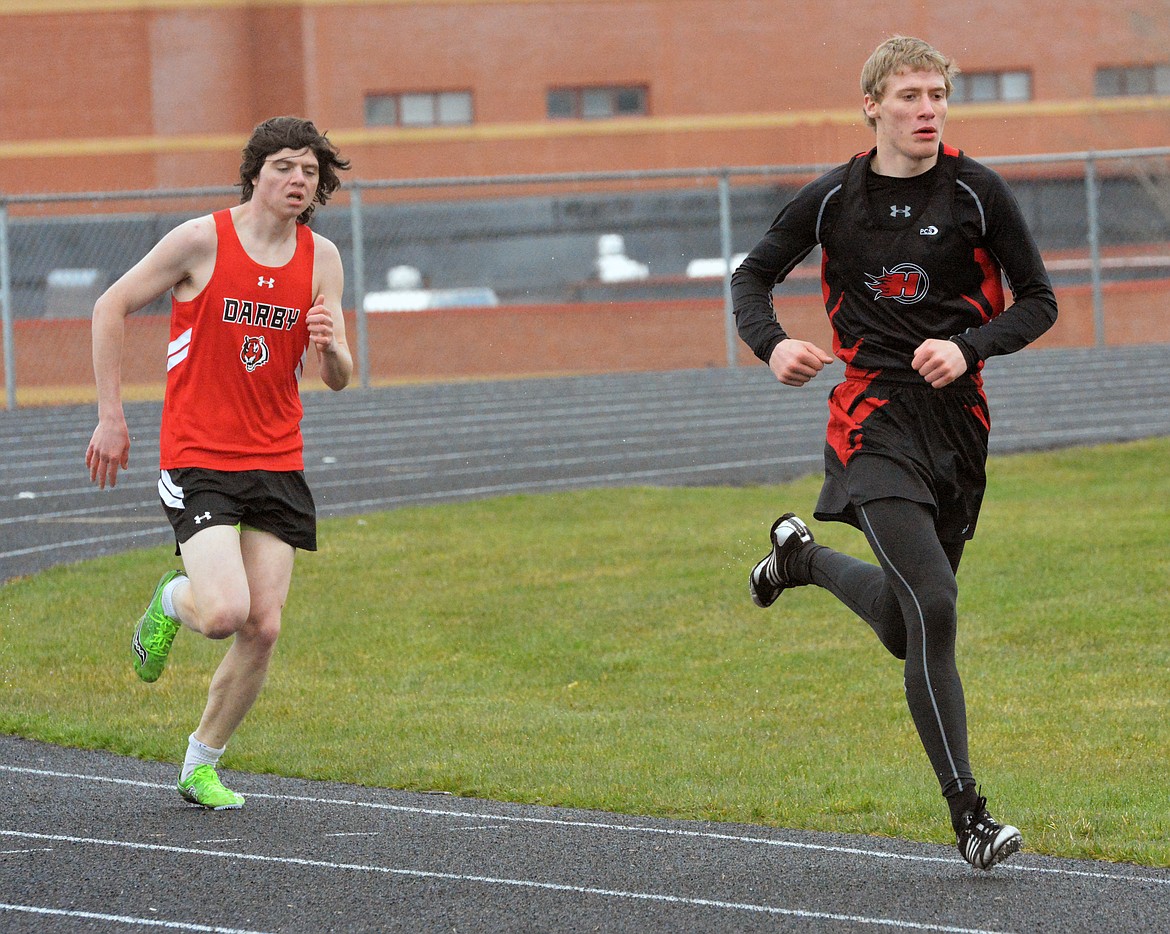 HOT SPRINGS distance runner James DeTienne leads the pack in the early portion of the 800-meter relay Thursday afternoon at the Dave Tripp Memorial track meet at Polson High School.