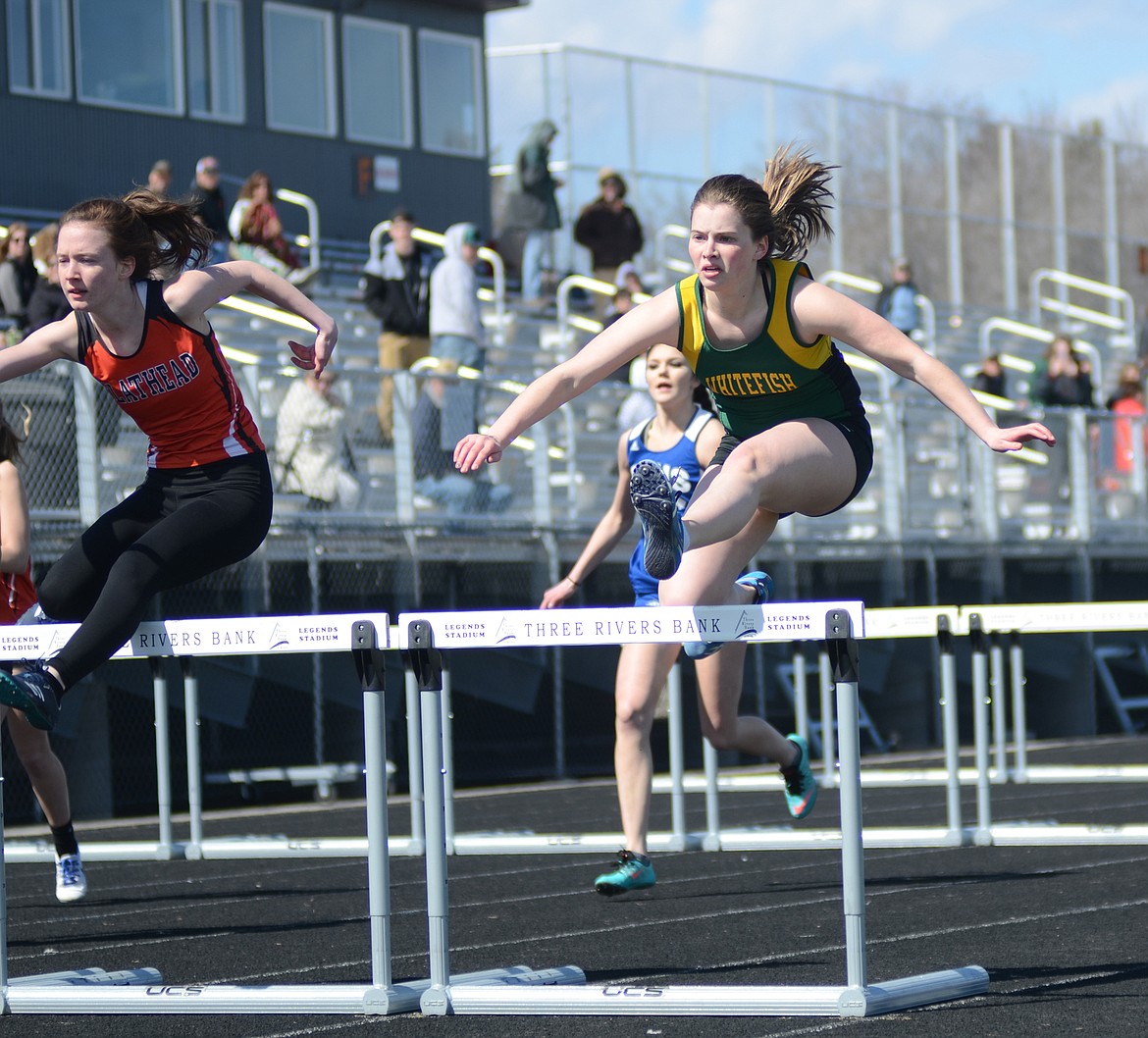 Jordan Hayes races toward the finish in the 100 hurdles last week at the Flathead Time Trials. (Daniel McKay photos/Whitefish Pilot)