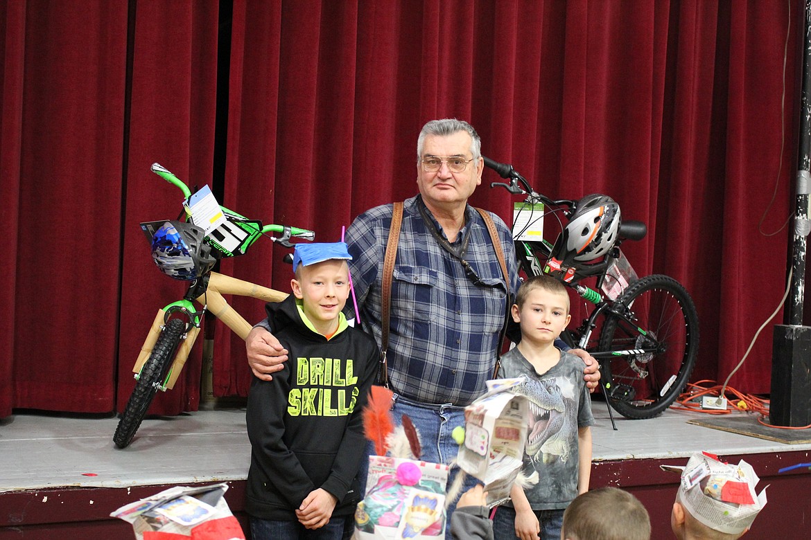 Elementary students Micah Acker and Colton Baughman won the grand prize of bikes donated by the Mason Lodge in Superior. Mason Ed Heppe was at the awards ceremony to give the bikes away. (Kathleen Woodford/Mineral Independent).