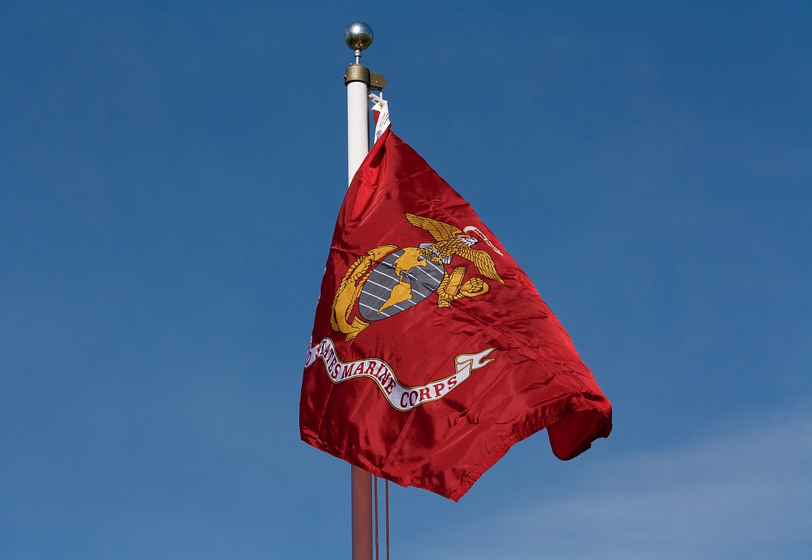 The new Marine Corps flag faps in the light wind at the Plains cemetery.