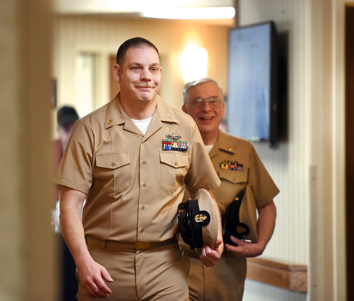 Chief Petty Officer Anthony Fluke strides down the halls of Brendan House in his dress uniform on Monday, fulfilling a promise he made 20 years ago to his grandmother Carroll Krause. The reunion was a complete surprise to Krause, who wept joyfully at the sight of her grandson. The staff of Brendan House gathered around to cheer for the family and many were crying at the emotion of the day. Krause received multiple hugs and well-wishes from staff members following the reunion.