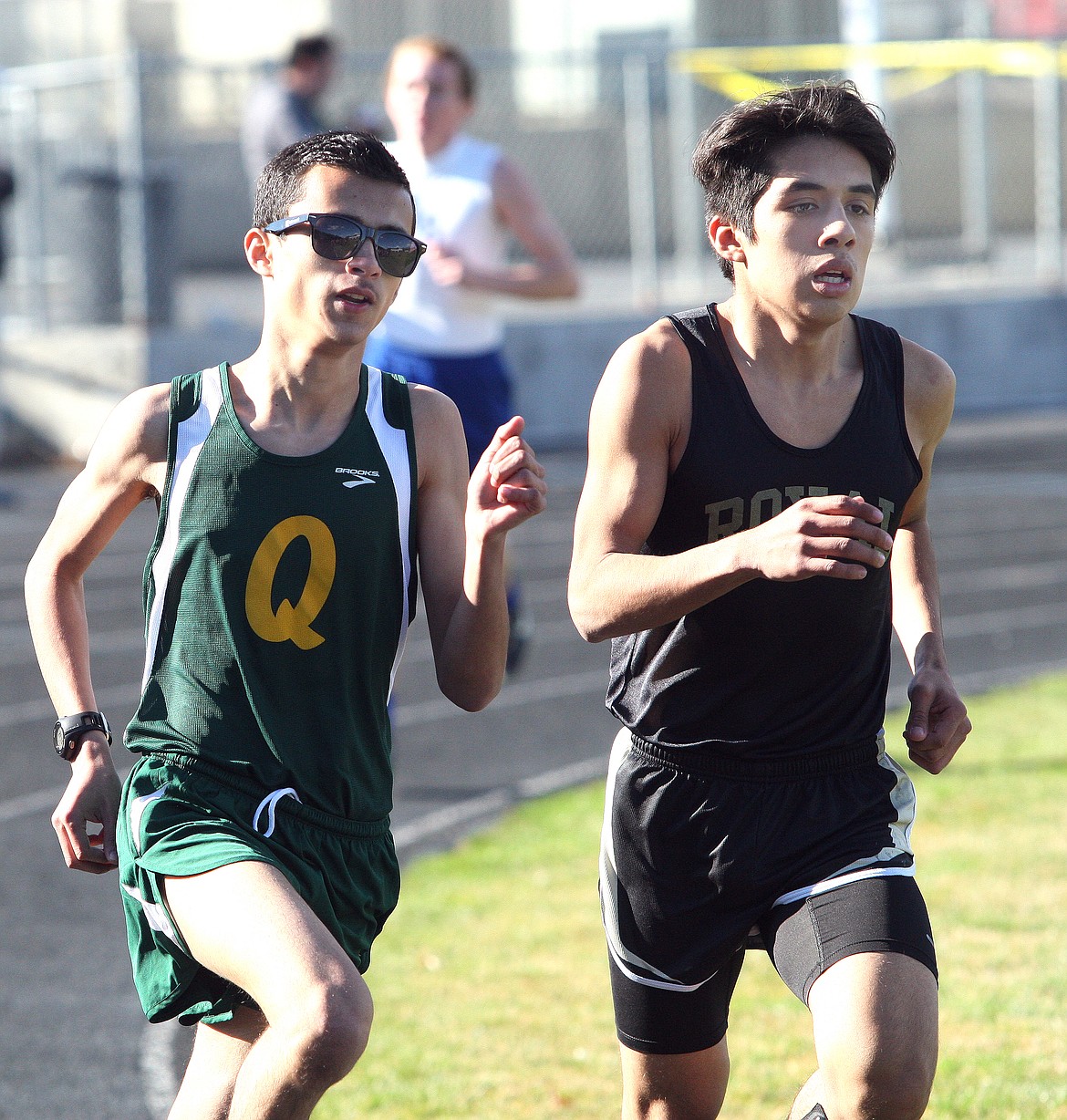 Rodney Harwood/The Sun Tribune - Royal's Silver Beltran and Gonzalo Birrueta of Quincy finished second and third, respectively, in the 1600 at the Best of the Basin track and field meet in Quincy.
