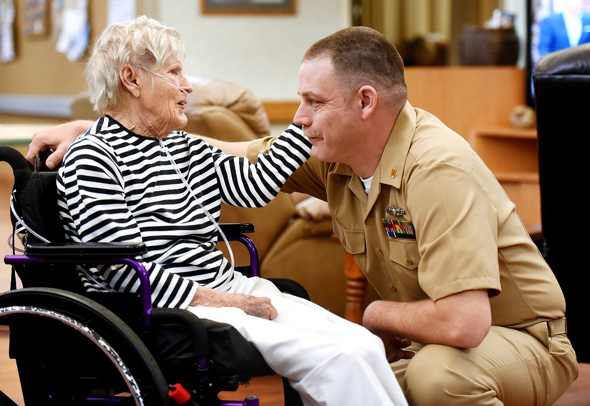 Carroll Krause gets an unimagined surprise as her grandson, Chief Petty Officer Anthony Fluke, makes good on his promise to someday come home from the Navy wearing his dress uniform on Monday morning at Brendan House in Kalispell. Fluke will be retiring after 20 years of service in October of this year.&#160;(Brenda Ahearn photos/Daily Inter Lake)