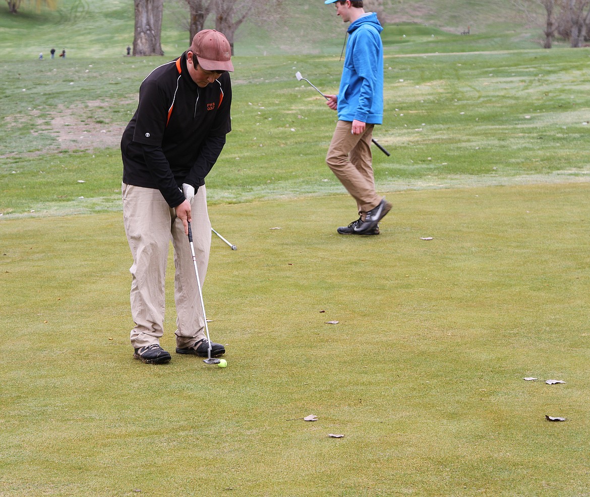 Connor Sampson works on a put during the Plains Invitational Golf meet at the Plains Golf course.  (Photo courtesy of Sam Rehbein)