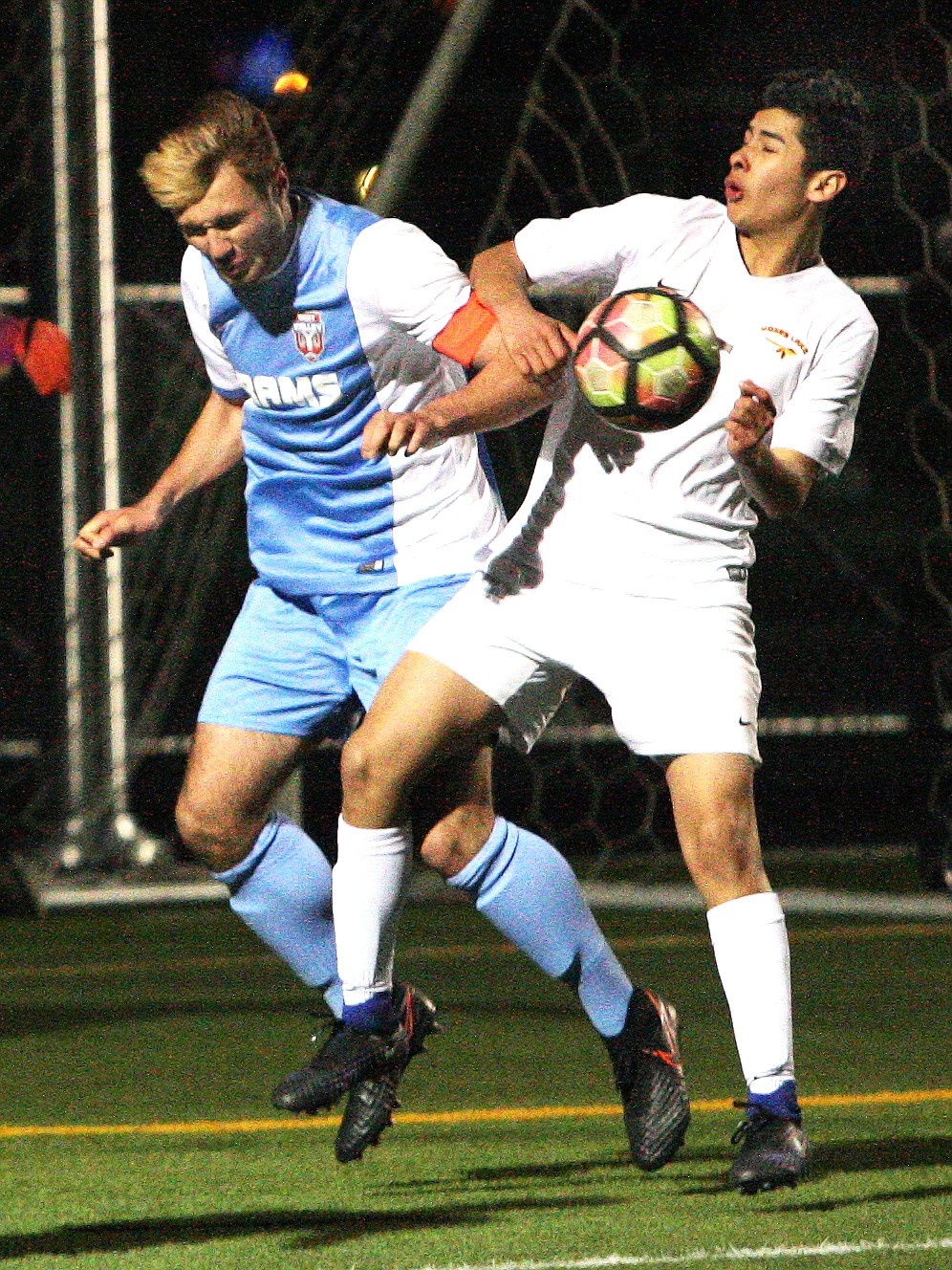 Rodney Harwood/Columbia Basin HeraldMoses Lake defender Josh Henriquez (5) fights for possession in the box off a corner kick with Kolbein Moore from West Valley. The Chiefs won the match Friday night at Lions Field 2-1 in a shootout.
