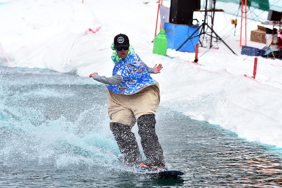 Skiers and snowboarders braved the pond skim competition Saturday at Whitefish Mountain Resort. The annual event marks the end of ski season. (Heidi Desch/Whitefish Pilot)