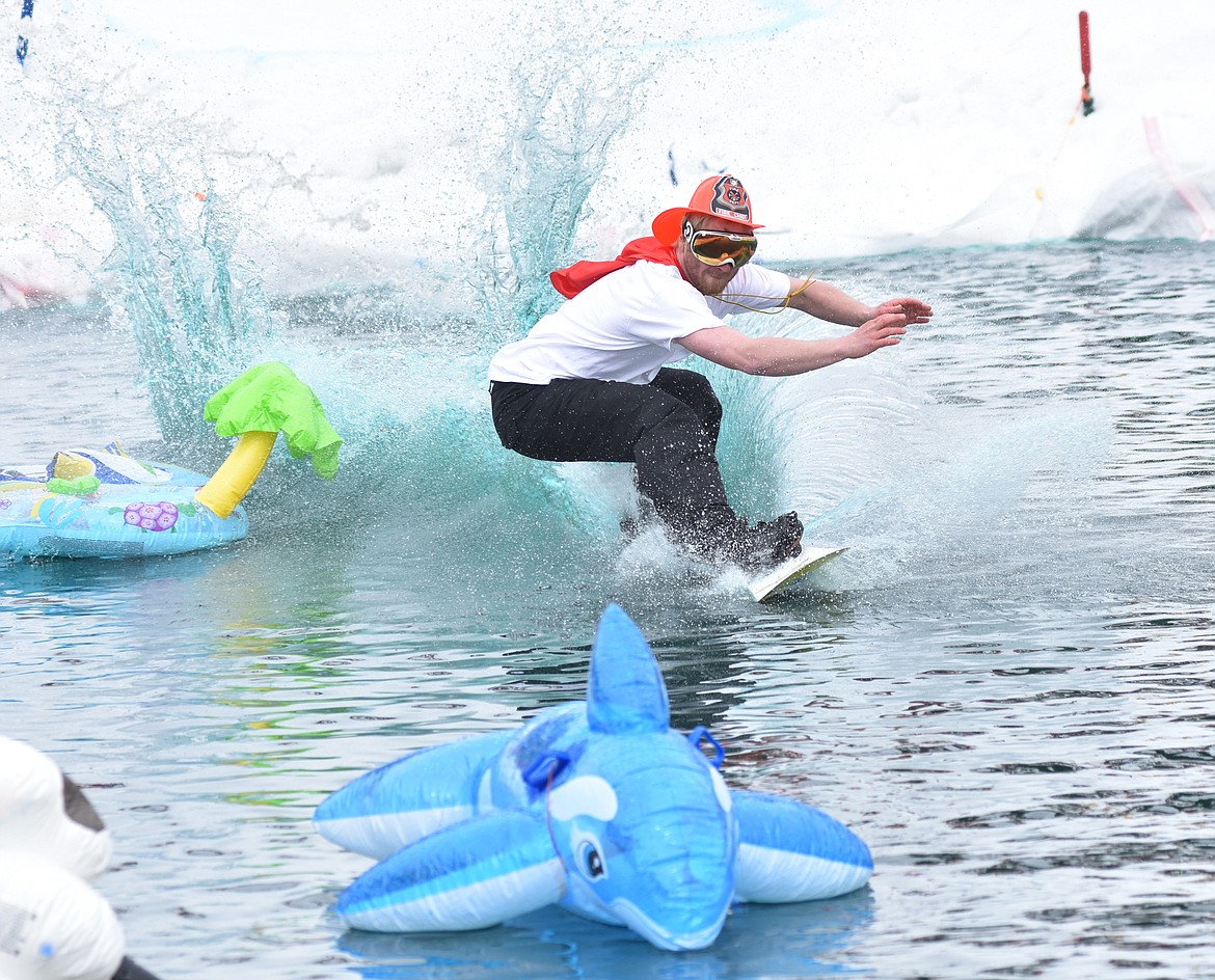 Skiers and snowboarders braved the pond skim competition Saturday at Whitefish Mountain Resort. The annual event marks the end of ski season. (Heidi Desch/Whitefish Pilot)