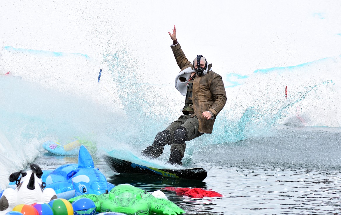 Skiers and snowboarders braved the pond skim competition Saturday at Whitefish Mountain Resort. The annual event marks the end of ski season. (Heidi Desch/Whitefish Pilot)