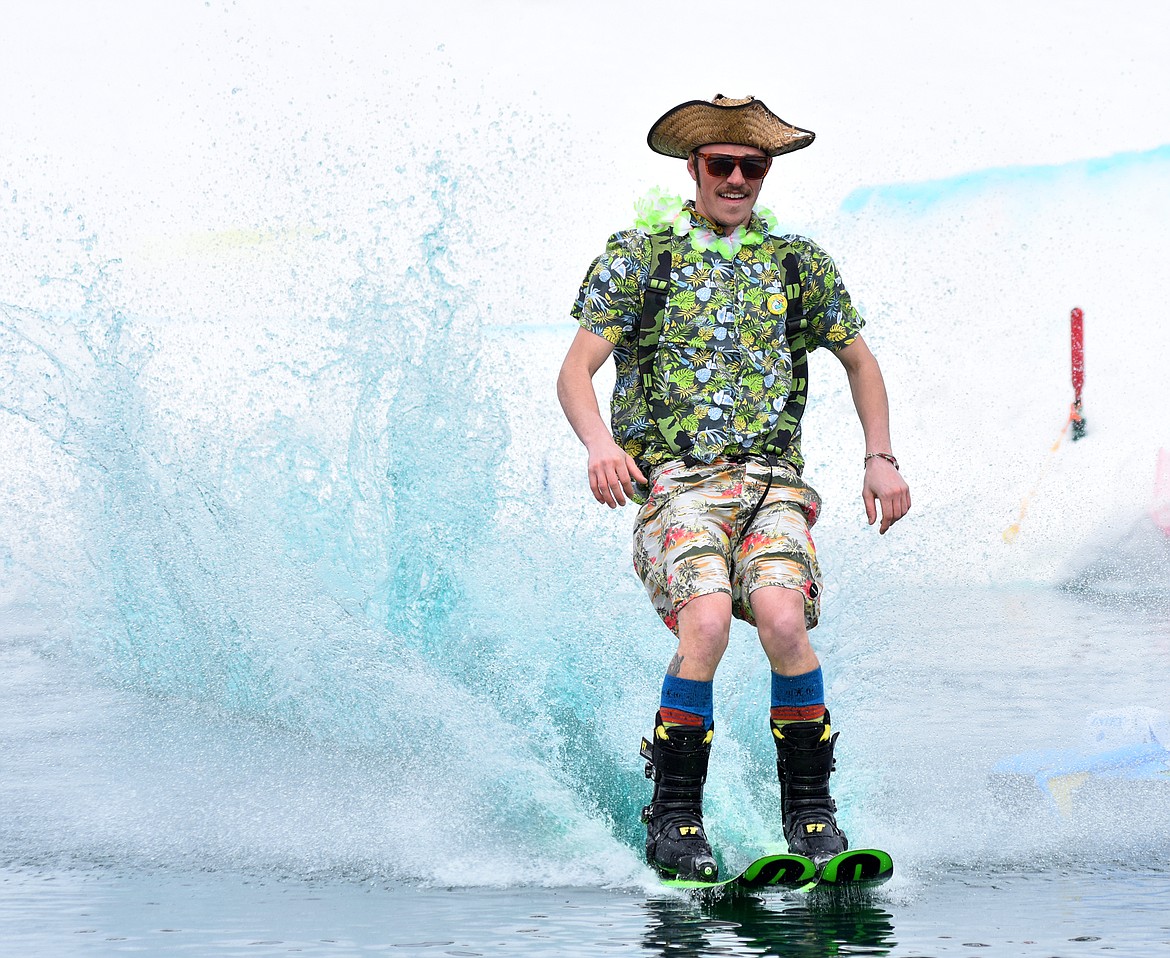 Skiers and snowboarders braved the pond skim competition Saturday at Whitefish Mountain Resort. The annual event marks the end of ski season. (Heidi Desch/Whitefish Pilot)