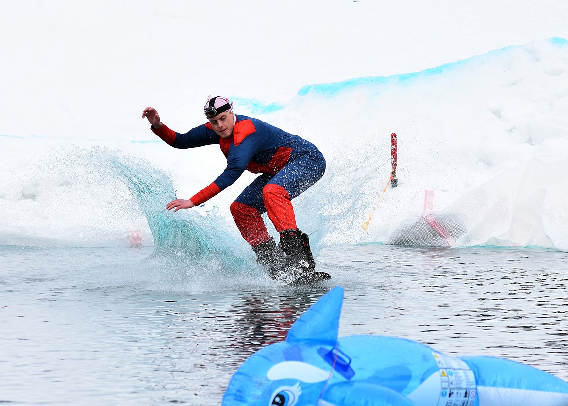 Skiers and snowboarders braved the pond skim competition Saturday at Whitefish Mountain Resort. The annual event marks the end of ski season. (Heidi Desch/Whitefish Pilot)