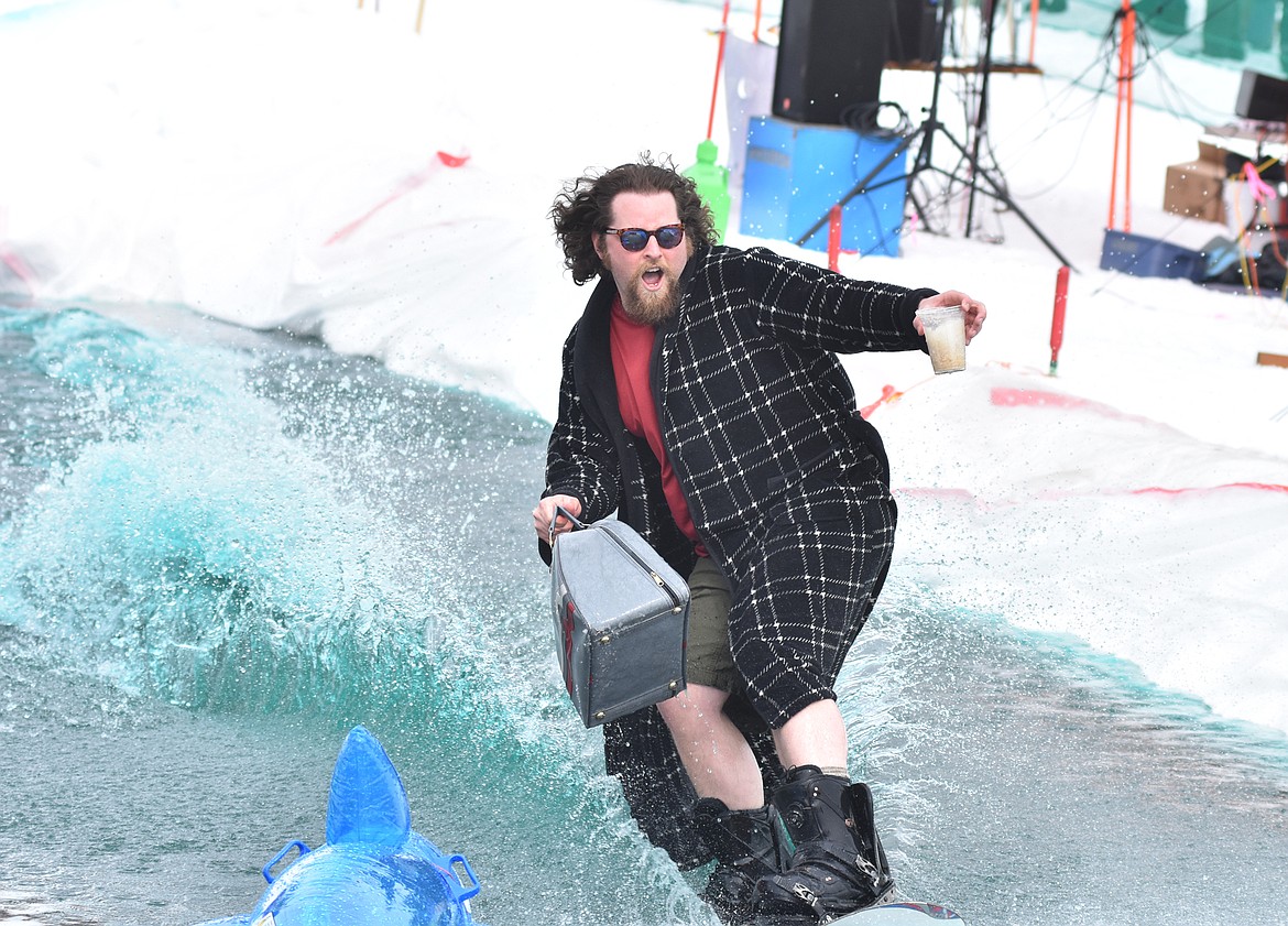 Skiers and snowboarders braved the pond skim competition Saturday at Whitefish Mountain Resort. The annual event marks the end of ski season. (Heidi Desch/Whitefish Pilot)