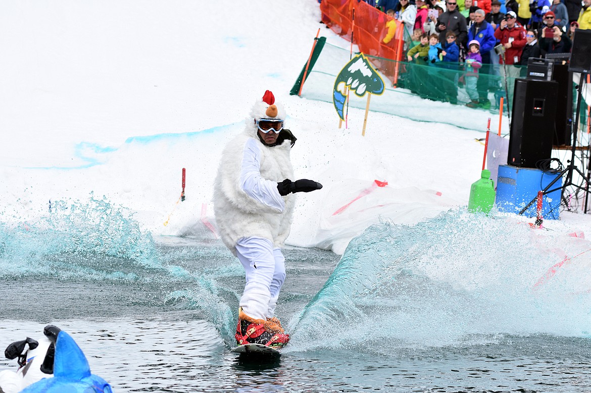 Skiers and snowboarders braved the pond skim competition Saturday at Whitefish Mountain Resort. The annual event marks the end of ski season. (Heidi Desch/Whitefish Pilot)