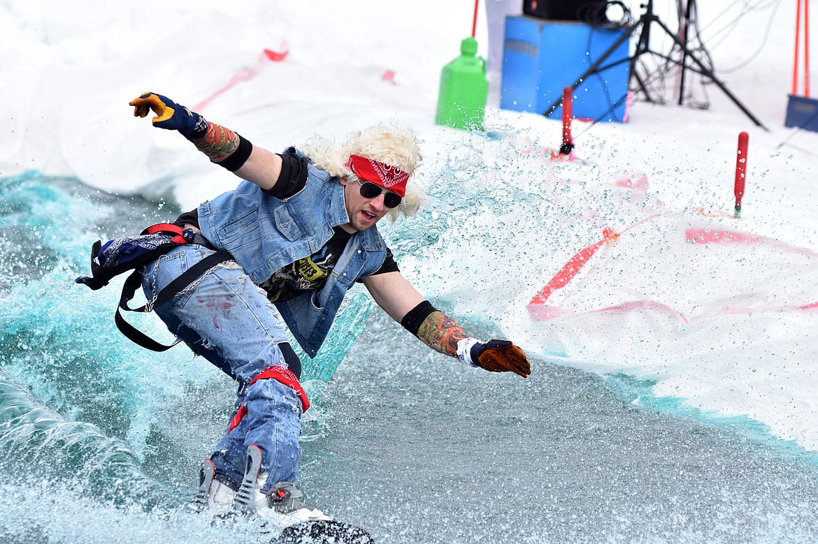 Skiers and snowboarders braved the pond skim competition Saturday at Whitefish Mountain Resort. The annual event marks the end of ski season. (Heidi Desch/Whitefish Pilot)