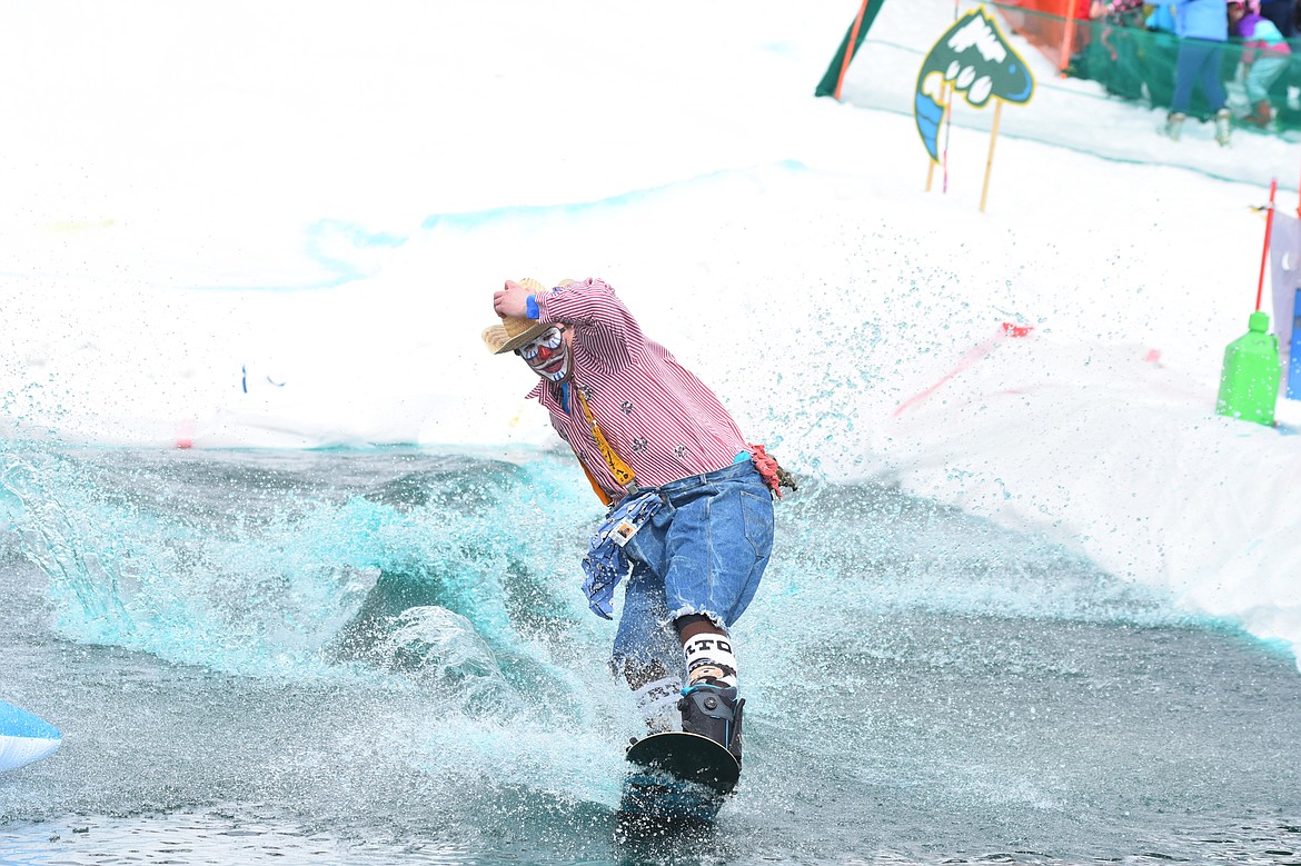 Skiers and snowboarders braved the pond skim competition Saturday at Whitefish Mountain Resort. The annual event marks the end of ski season. (Heidi Desch/Whitefish Pilot)