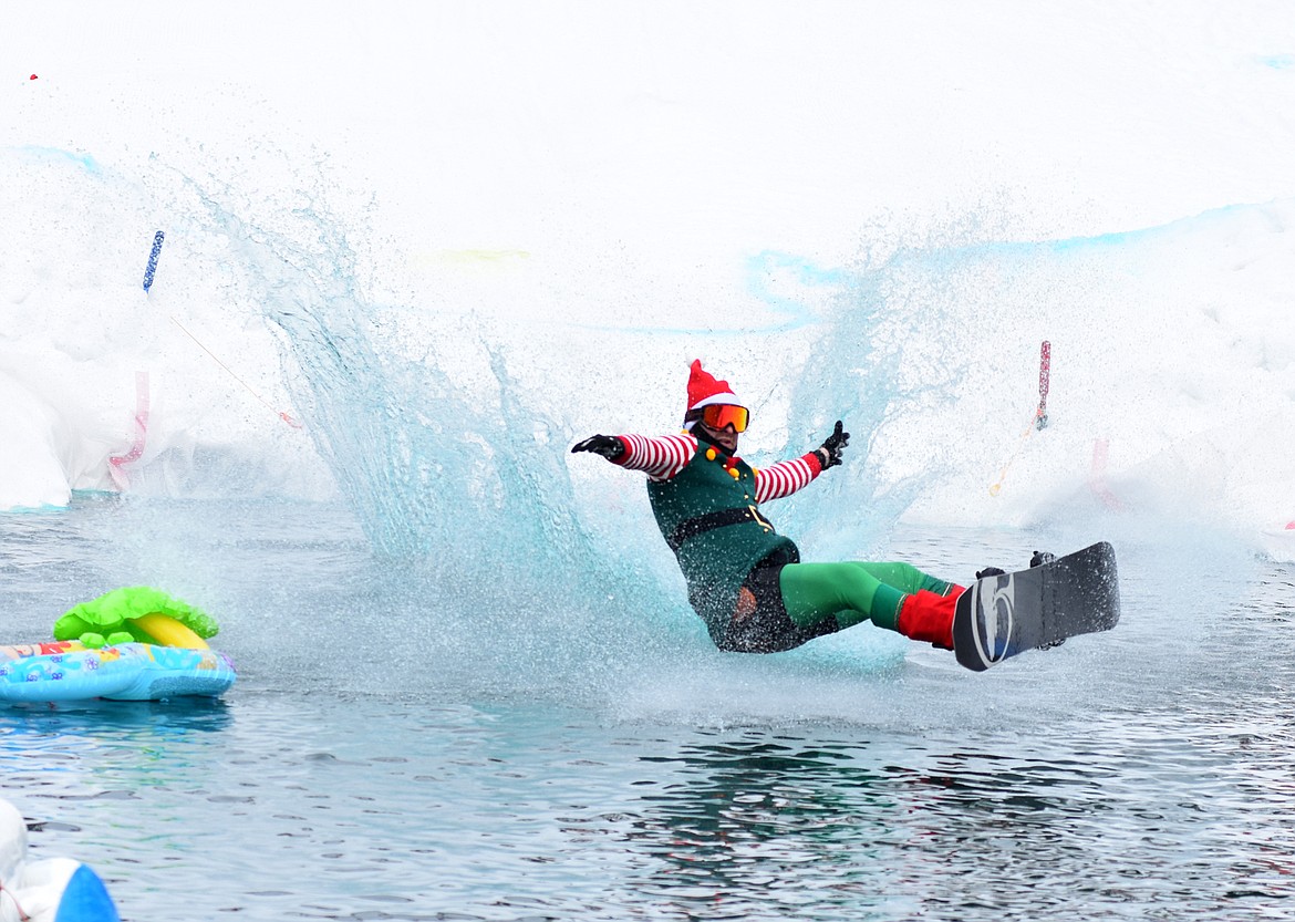 Skiers and snowboarders braved the pond skim competition Saturday at Whitefish Mountain Resort. The annual event marks the end of ski season. (Heidi Desch/Whitefish Pilot)